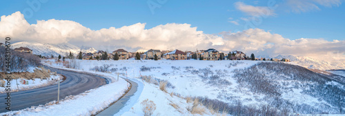 Houses on a snowy highland area at Draper, Utah with Mount Timpanogos view © Jason
