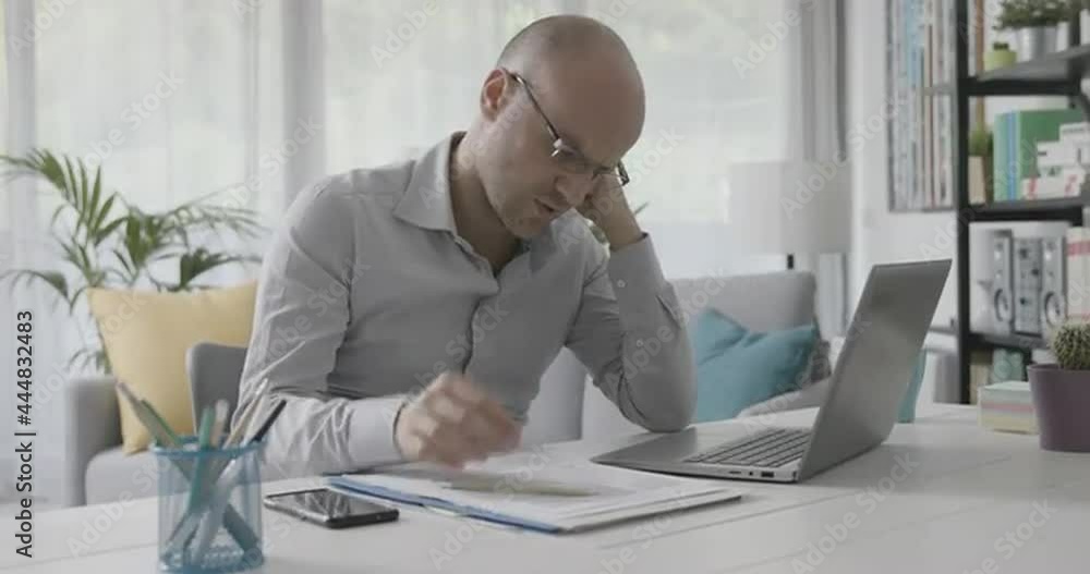 Frustrated businessman working from home Frustrated businessman working from home