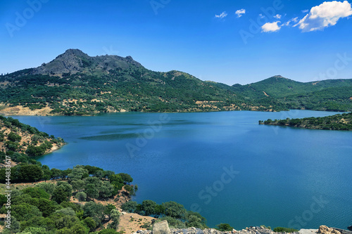 A blue lake and sky among green mountains at Gökceada, Imbros Canakkale Turkey. dam, barrage, view