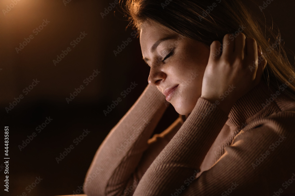 Young woman sitting in the dark. Staying up late Young woman sitting in the dark. Staying up late