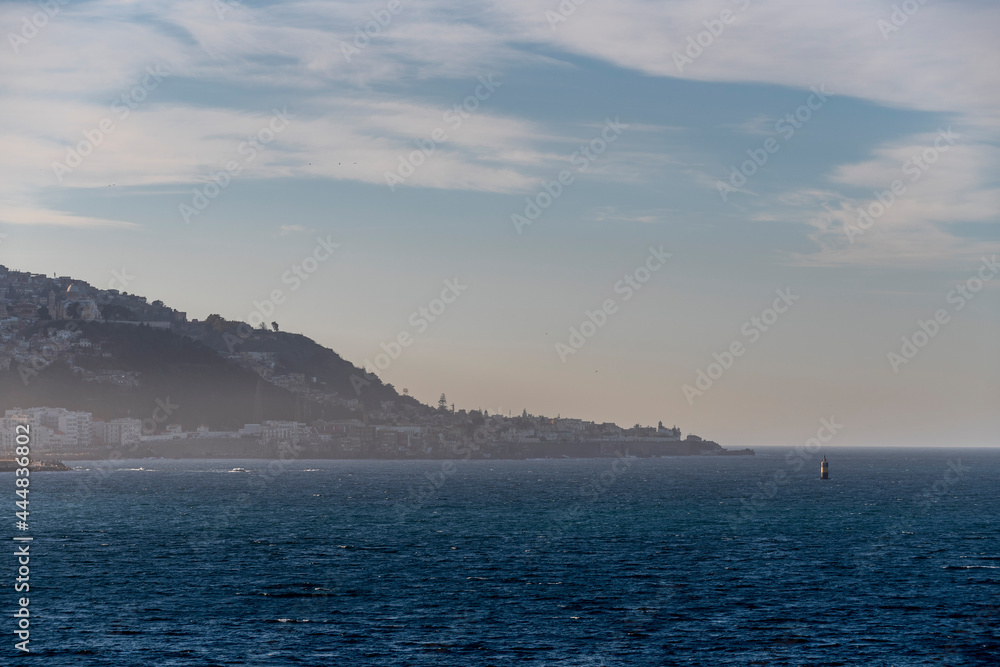 View to Algiers port at sunset. Calm weather. View from vessel. View to Algiers port at sunset. Calm weather. View from vessel.