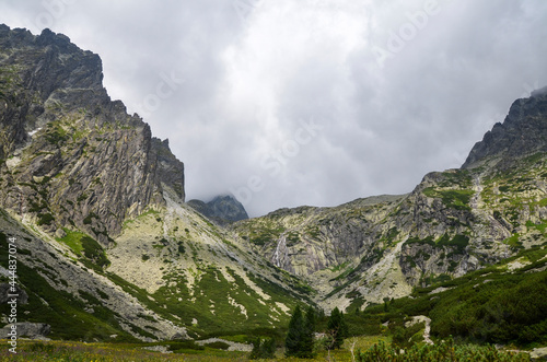 Beautiful sharp rocky peaks of mountain ranges under cloudy sky in the High Tatras, Slovakia © Dmytro