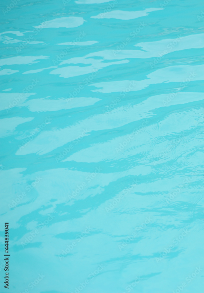 Blue water background. Swimming pool background.
