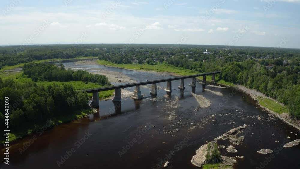 Train bridge over a river in Canada from drone