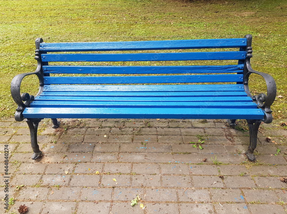 A blue wooden bench in close-up. Park bench for recreation A blue wooden bench in close-up. Park bench for recreation