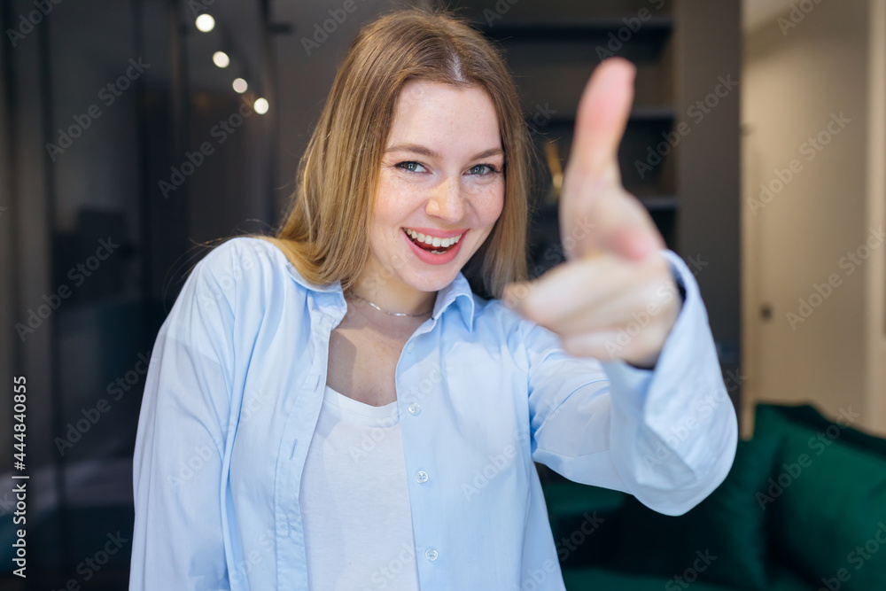 Young girl in casual clothes pointing with her fingers at the camera with a happy and funny face. good energy and vibes