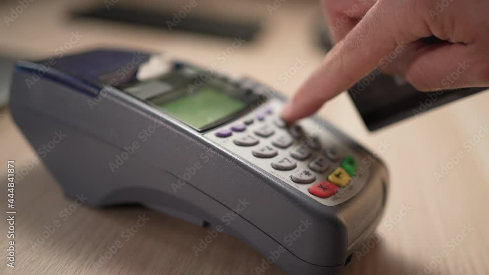 Swiping a Credit Card at a Store on The Terminal Closeup Swiping a Credit Card at a Store on The Terminal Closeup