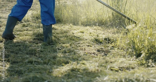 Wallpaper Mural Gardener mowing grass with trimmer machine in close up slow motion Torontodigital.ca
