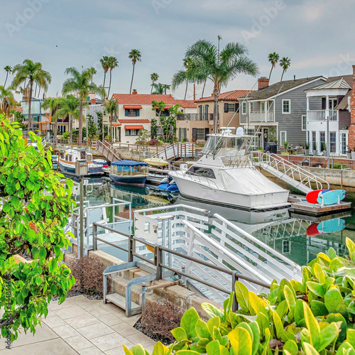 Tablou canvas Square Long Beach coastal neighborhood landscape with boats and docks on the can