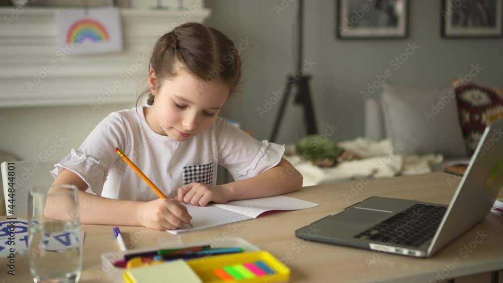 Contemporary online education girl writes task in notebook Spbd Contemporary online education girl writes task in notebook Spbd