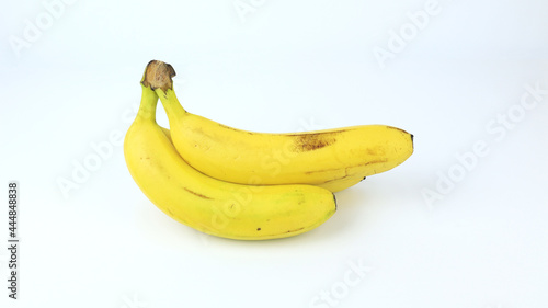 fresh bananas of the Cavendish variety on a white background