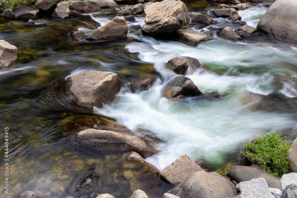 Roaring rapids rushing through forest scape Roaring rapids rushing through forest scape
