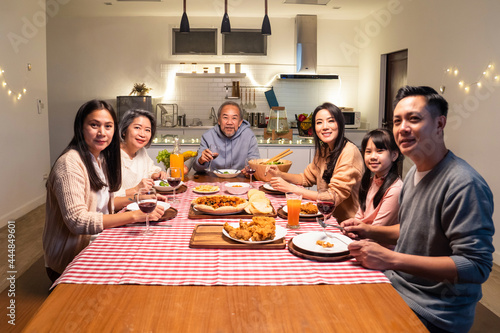 Portrait of Asian Big happy family having dinner together in house.