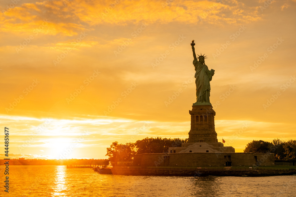 The Statue of Liberty at New York city during sunset
