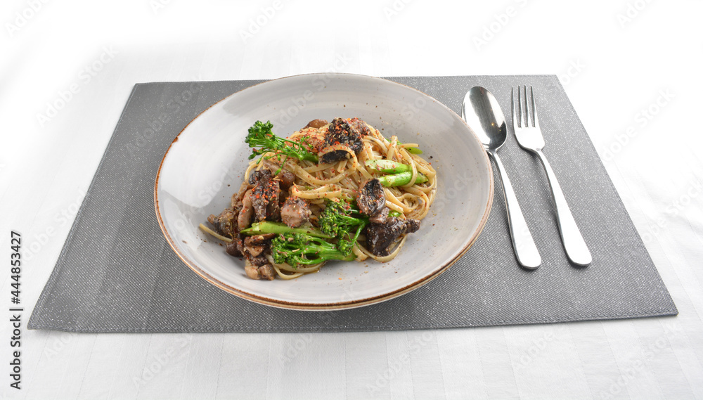 fried olive oil vegetarian mushroom with vegetable pasta in alio olio style western halal menu