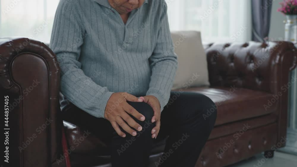 Senior adult with a painful expression from a serious legs and knee pain having difficulty
