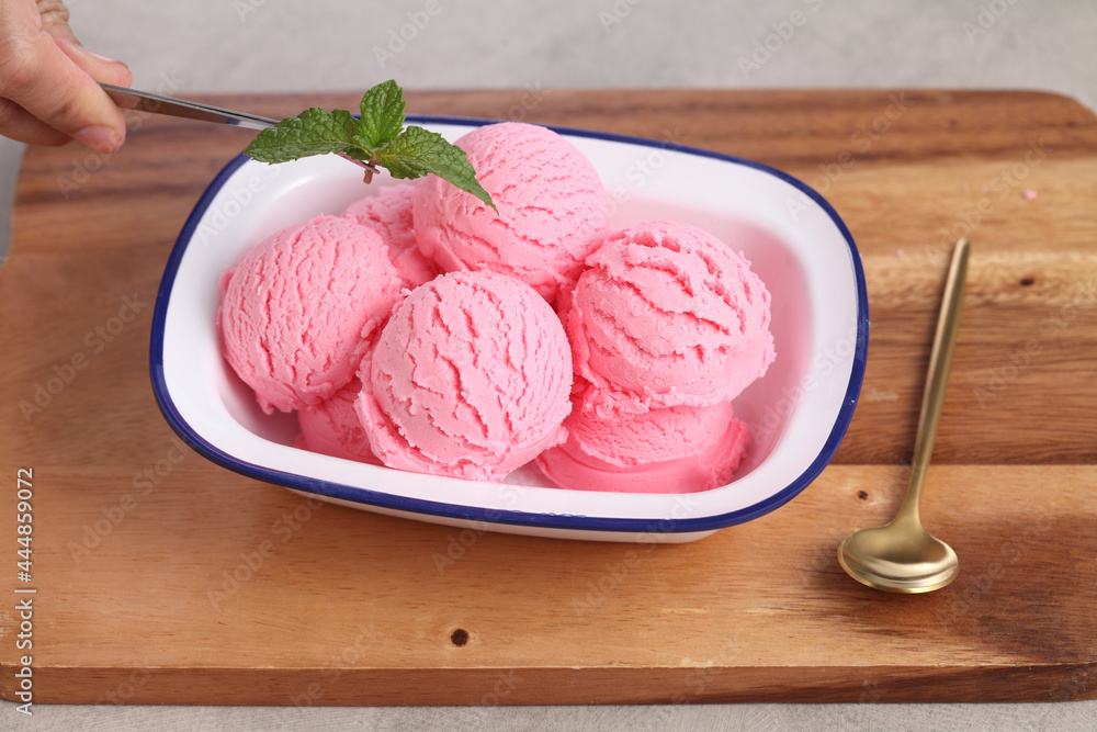 Food stylist use tweezers decorating fake icecream Food stylist use tweezers decorating fake icecream
