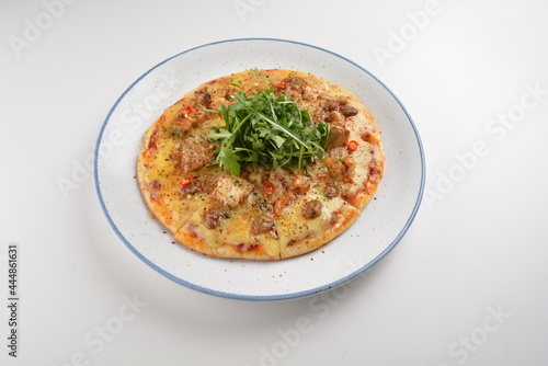 baked cheesy pizza with bbq sauce chicken and duck meat in white background western halal menu