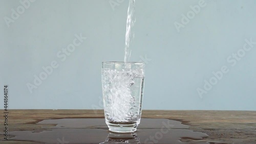 slow motion of pouring water into glass. Full HD