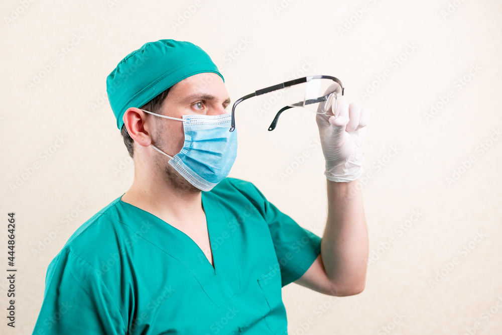 Doctor with goggles in his hands Doctor with goggles in his hands
