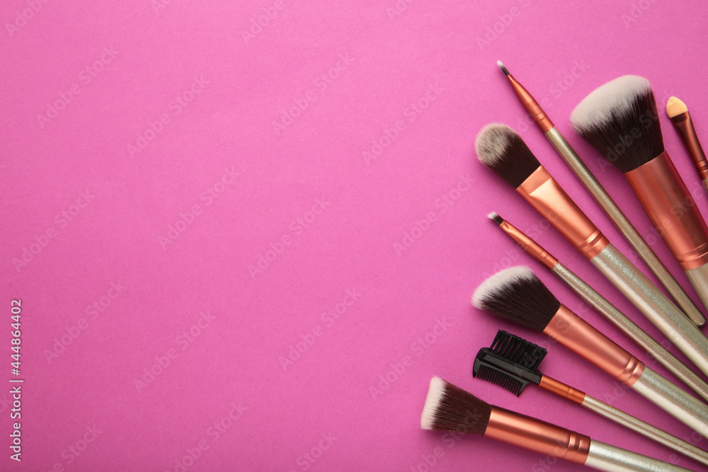 Professional make-up brushes on a pink background. Professional make-up brushes on a pink background.
