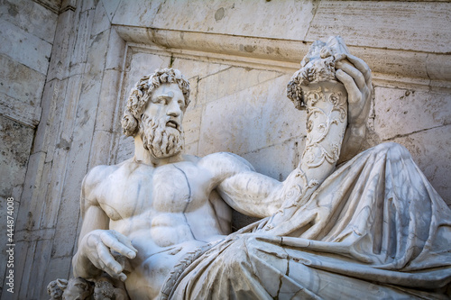 Statue of Tiberinus in front of the Palazzo Senatorio (Senatorial Palace) at the Piazza del Campidoglio in Rome, Italy photo