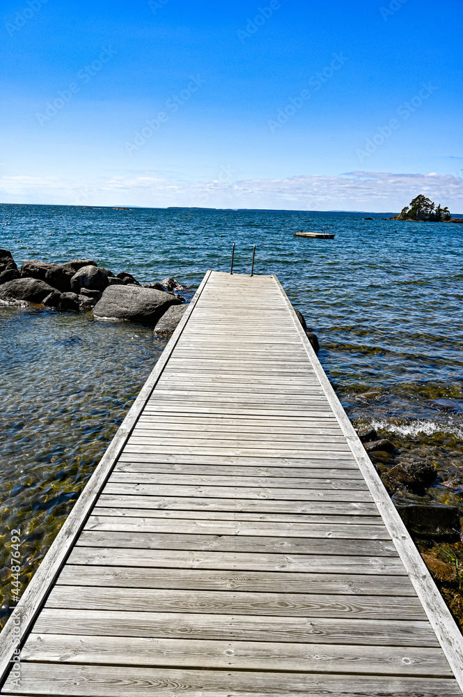 Fototapeta premium jetty with bathing ladder in lake Vattern Sweden