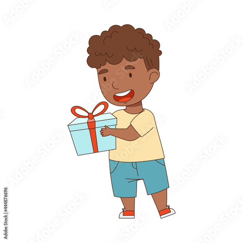 Little African American Boy Holding Gift Box as Holiday Present Vector Illustration © Happypictures