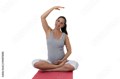 Beautiful pregnant woman doing yoga isolated on the white background