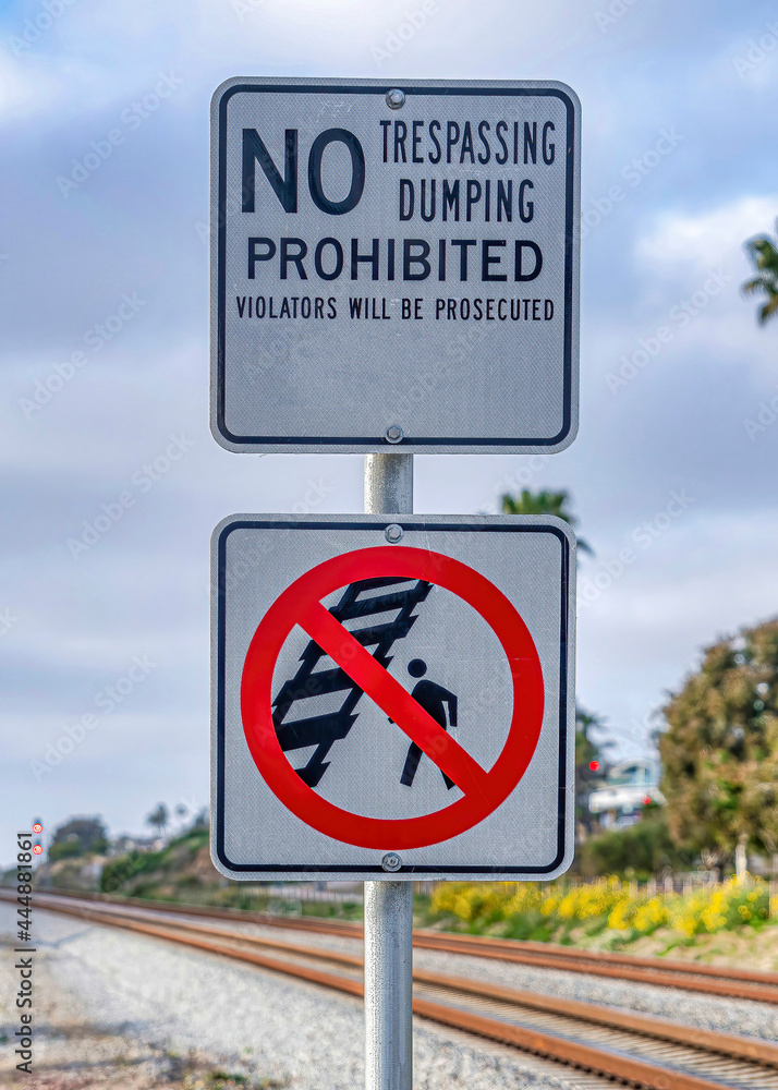 Vertical No Walking on Railway sign and No Trespassing and Dumping sign in San Diego CA Vertical No Walking on Railway sign and No Trespassing and Dumping sign in San Diego CA
