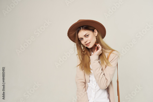elegant woman in hat modern style fashion posing studio