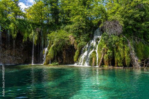 Waterfall with turquoise water in the Plitvice Lakes National Park  Croatia.