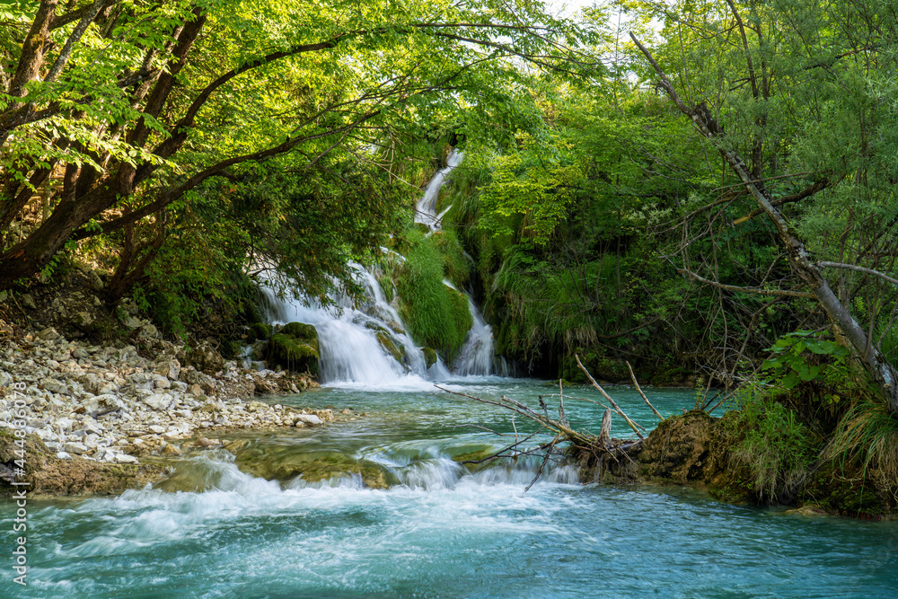 Waterfall with turquoise water in the Plitvice Lakes National Park, Croatia. Waterfall with turquoise water in the Plitvice Lakes National Park, Croatia.