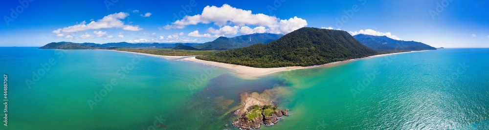 Aerial image of Thornton Beach located in the Cape Tribulation section of Daintree National Park, located in the tropical far north of Queensland, Australia.