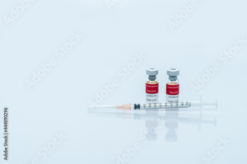 Covid-19 Corona vaccine vials medicine drug bottles syringe injection. Vaccination, immunization, treatment to cure Covid 19 Corona Virus infection. Healthcare And Medical concept.