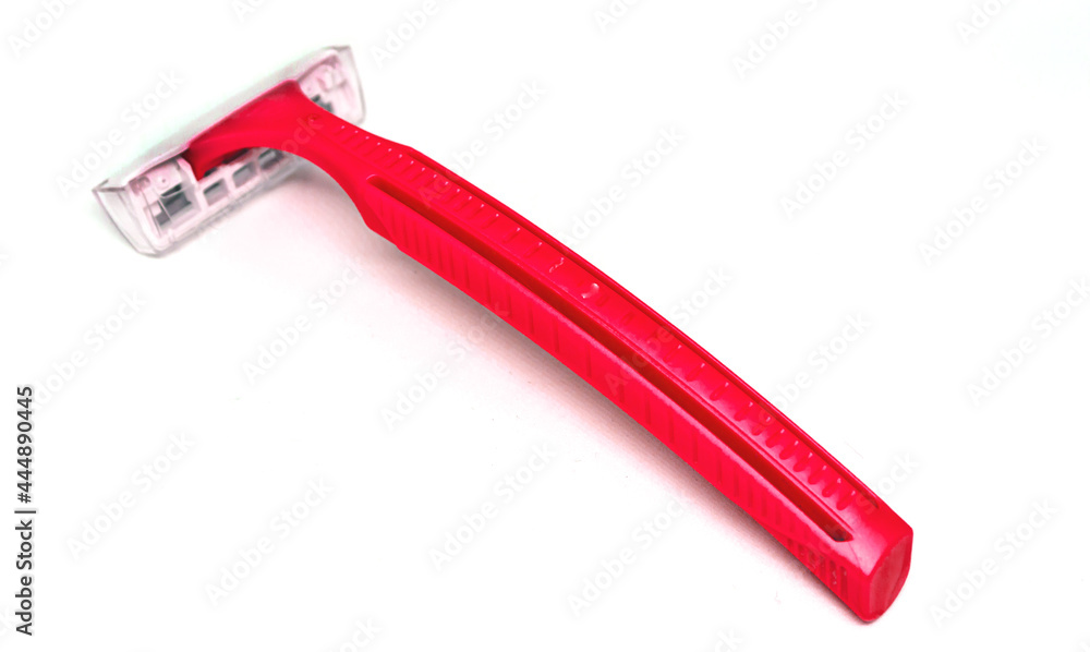 red disposable razor isolated on white background red disposable razor isolated on white background