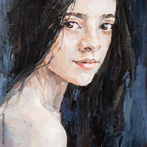 Fototapeta Naklejka Na Ścianę i Meble -  Portrait of a brunette girl. The background is dark blue.