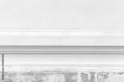 Vintage white painted cement wall with rough surface texture and background seamless