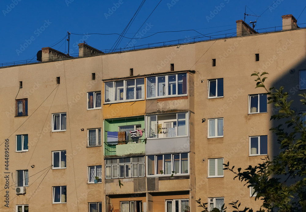 View of an old apartment building. Facade background of an old high-rise building. 