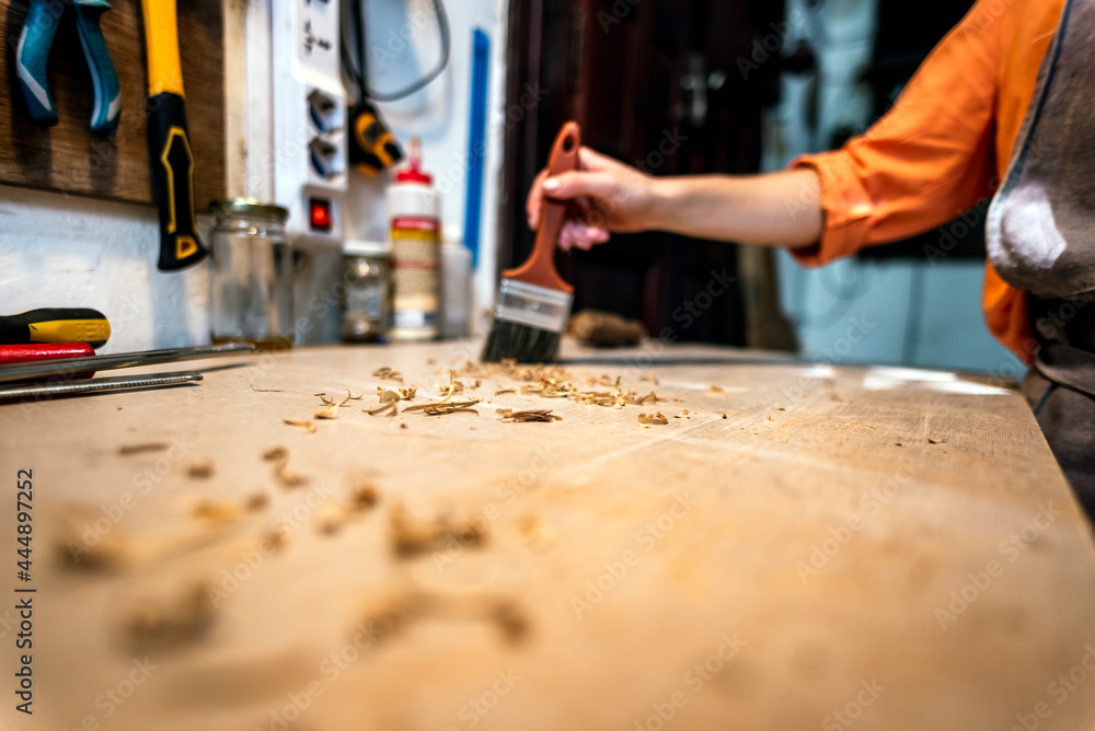 Unrecognized luthier woman in traditional workshop Unrecognized luthier woman in traditional workshop
