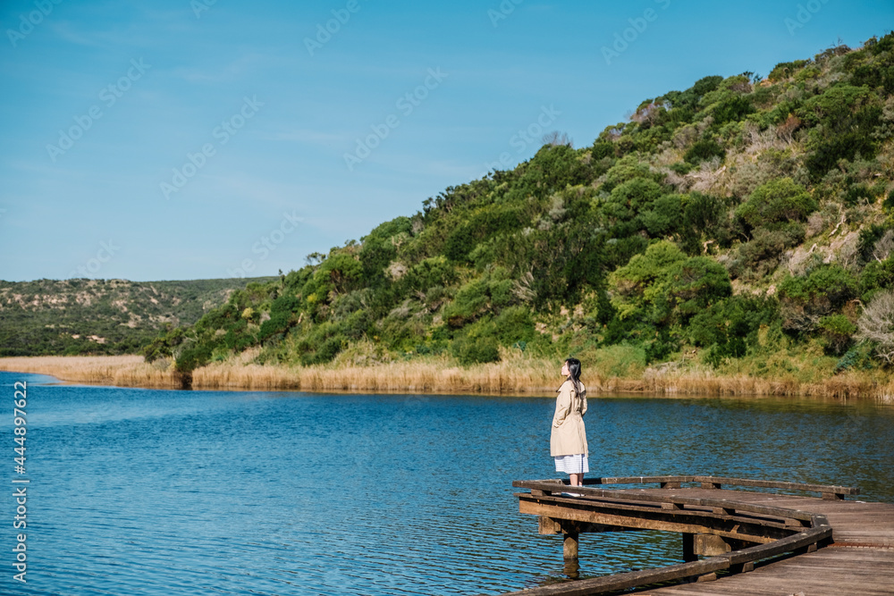 girl on bridge and lake view