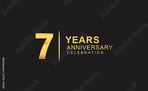7th years anniversary celebration design with golden color isolated on black background for celebration event photo
