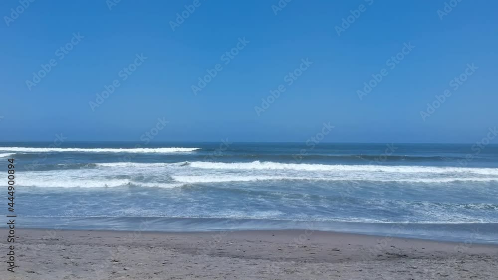Panoramic aerial shot approaching the beach on a sunny day Panoramic aerial shot approaching the beach on a sunny day