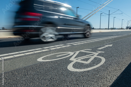 City street bicycle lane in heavy traffic with motion blur
