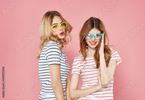Photography two funny girlfriends with glasses fashionable clothes summer friendship