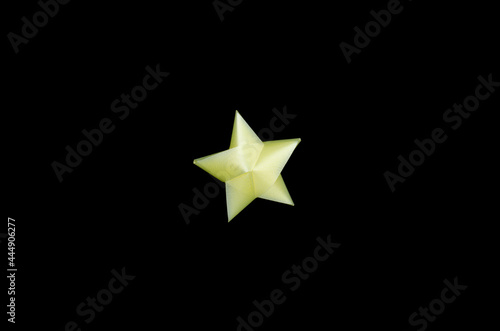 Yellow Christmas bow ribbon isolated on the black background with clipping path