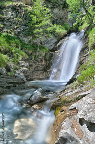 Fototapeta Naklejka Na Ścianę i Meble -  Waterfall on the Varaita stream, climbing towards the Agnello hill in Valvaraita