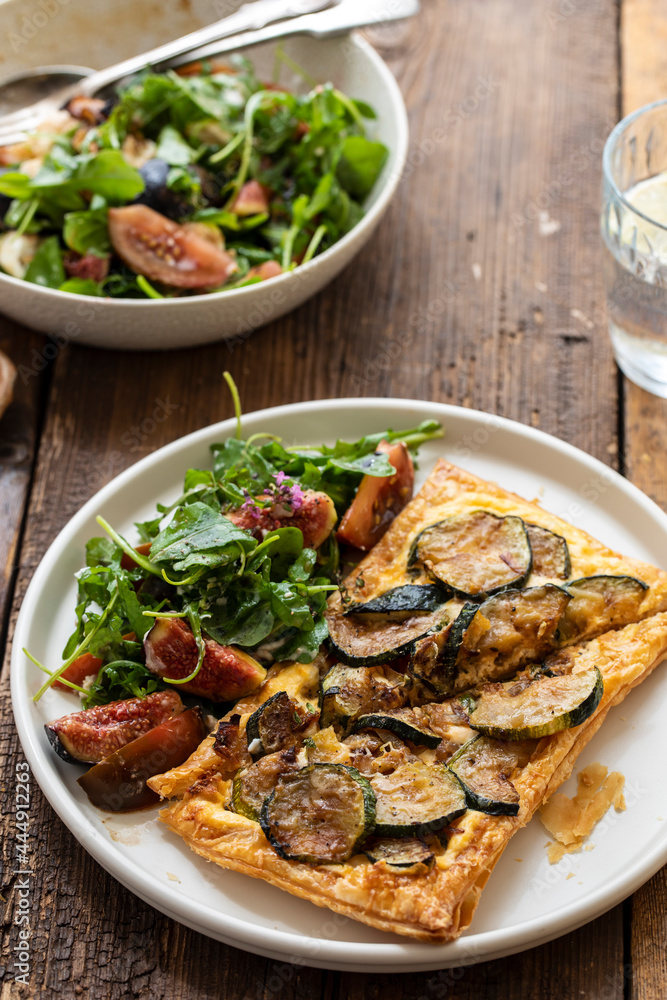 Puff pastry tart with caramelized courgettes and cheese with side of fig salad Puff pastry tart with caramelized courgettes and cheese with side of fig salad