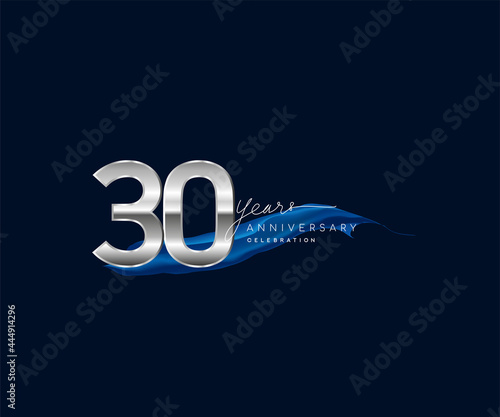 30th Years Anniversary celebration logotype silver colored with blue ribbon and isolated on dark blue background