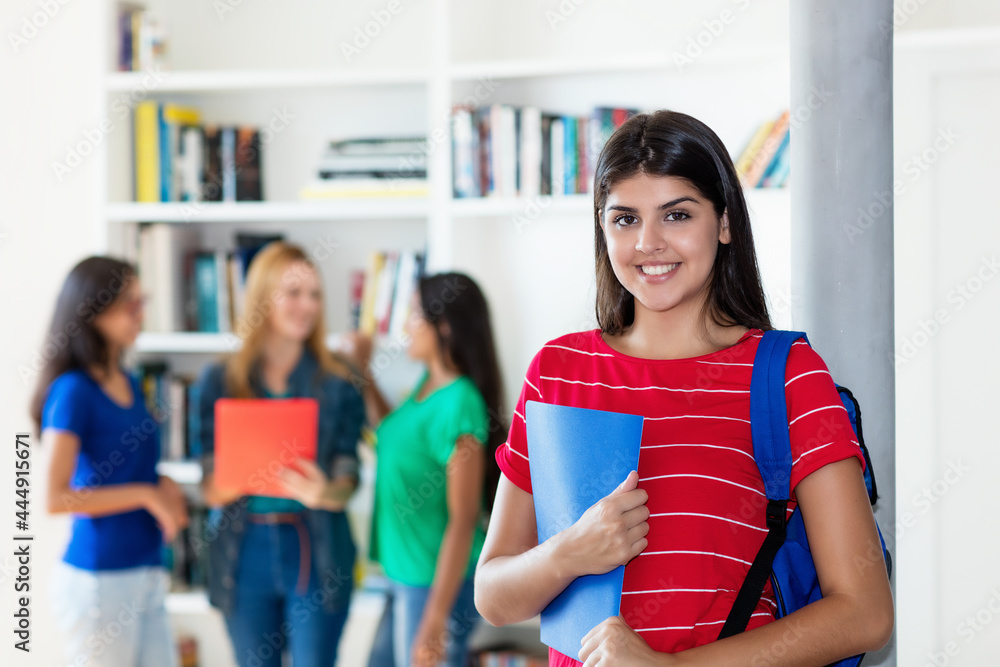 Laughing hispanic female student with group of multi ethnic college students Laughing hispanic female student with group of multi ethnic college students